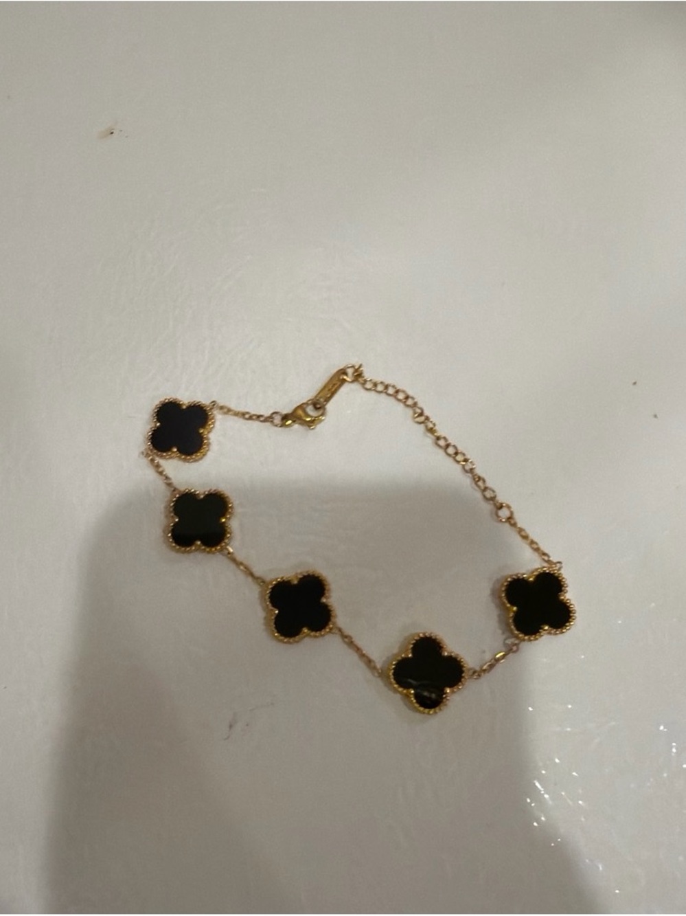 Gold Bracelet with Black Clover Accents